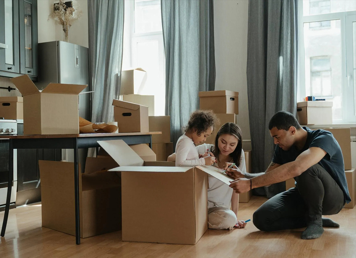 A family is sitting in the living room