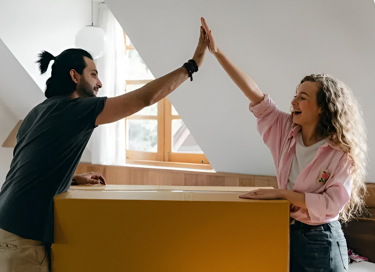 Two people giving each other a high five