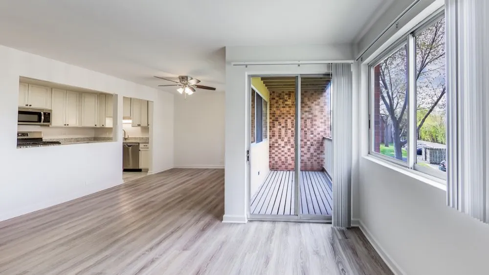A room with wood floors and white walls.