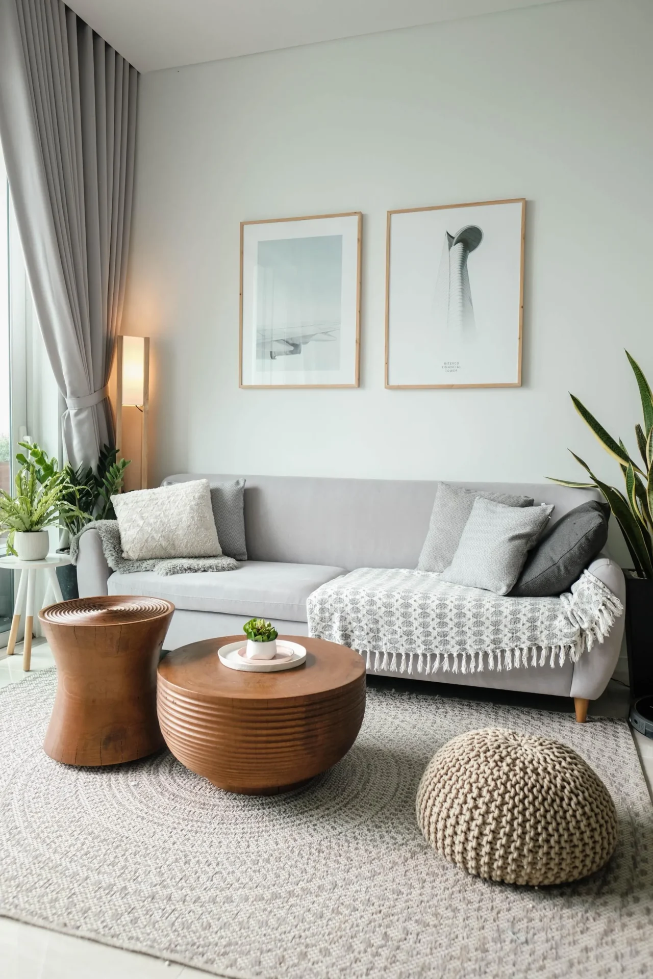 A living room with two pictures on the wall